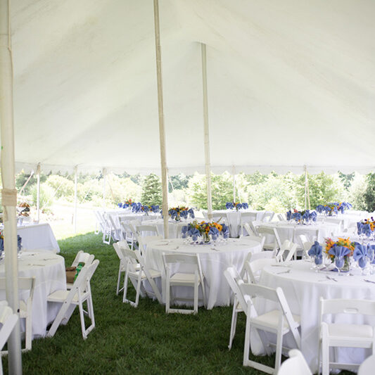 Wedding Reception with White Tablecloths and Colorful Centerpiec